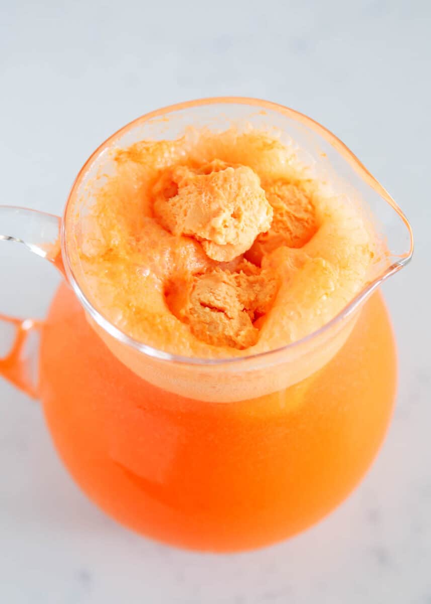 orange punch in glass pitcher