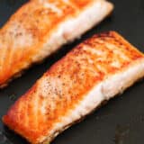 salmon cooking in skillet