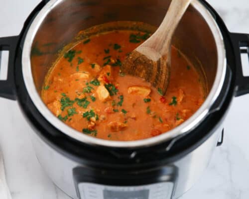 butter chicken in the instant pot with spoon