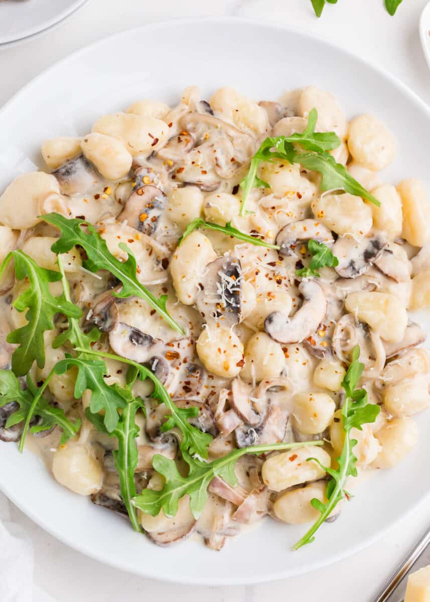 plate full of mushroom gnocchi