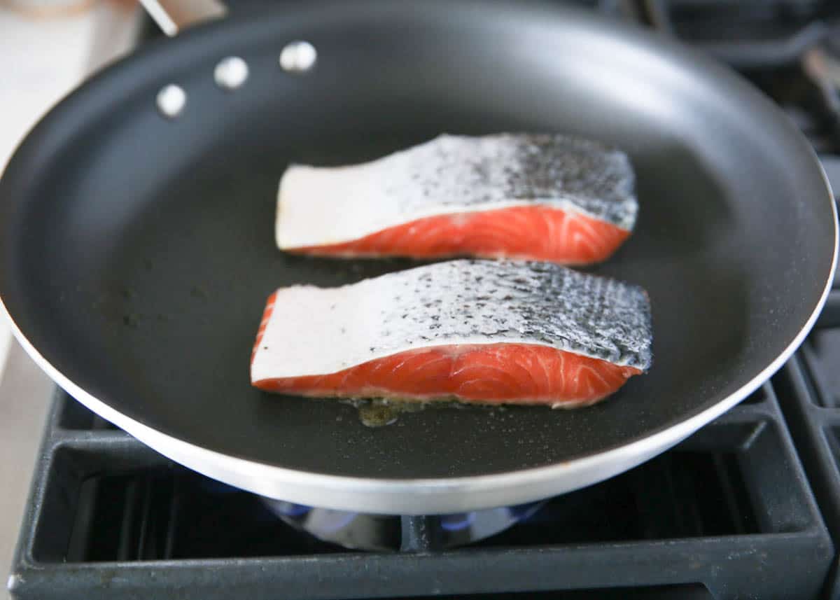 cooking salmon skin side up in skillet