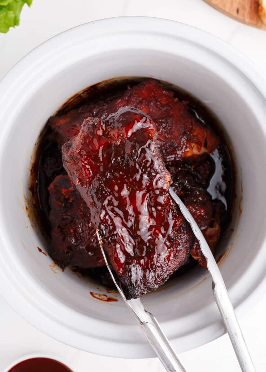 pulling ribs out of slow cooker