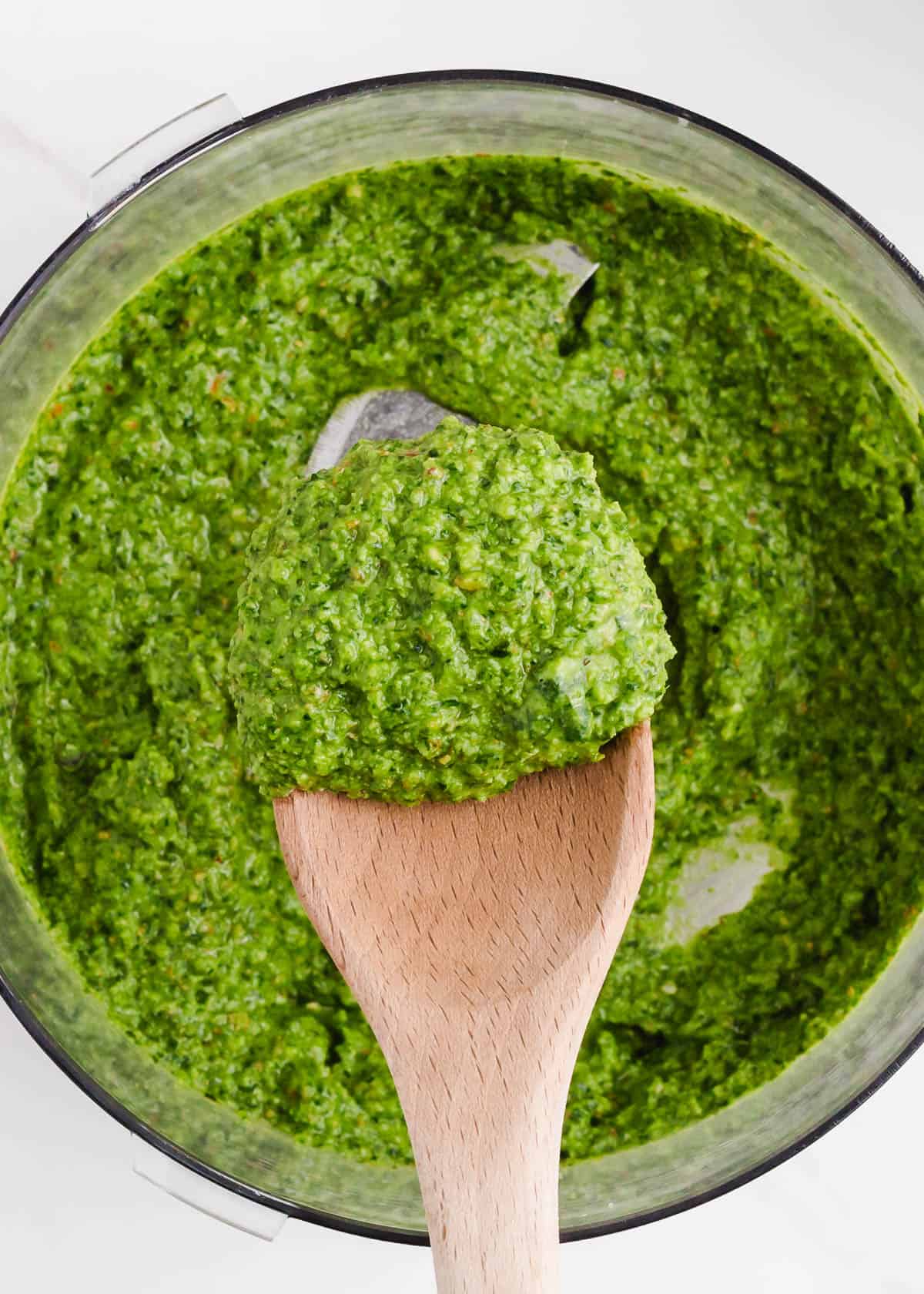 wooden spoon with pesto