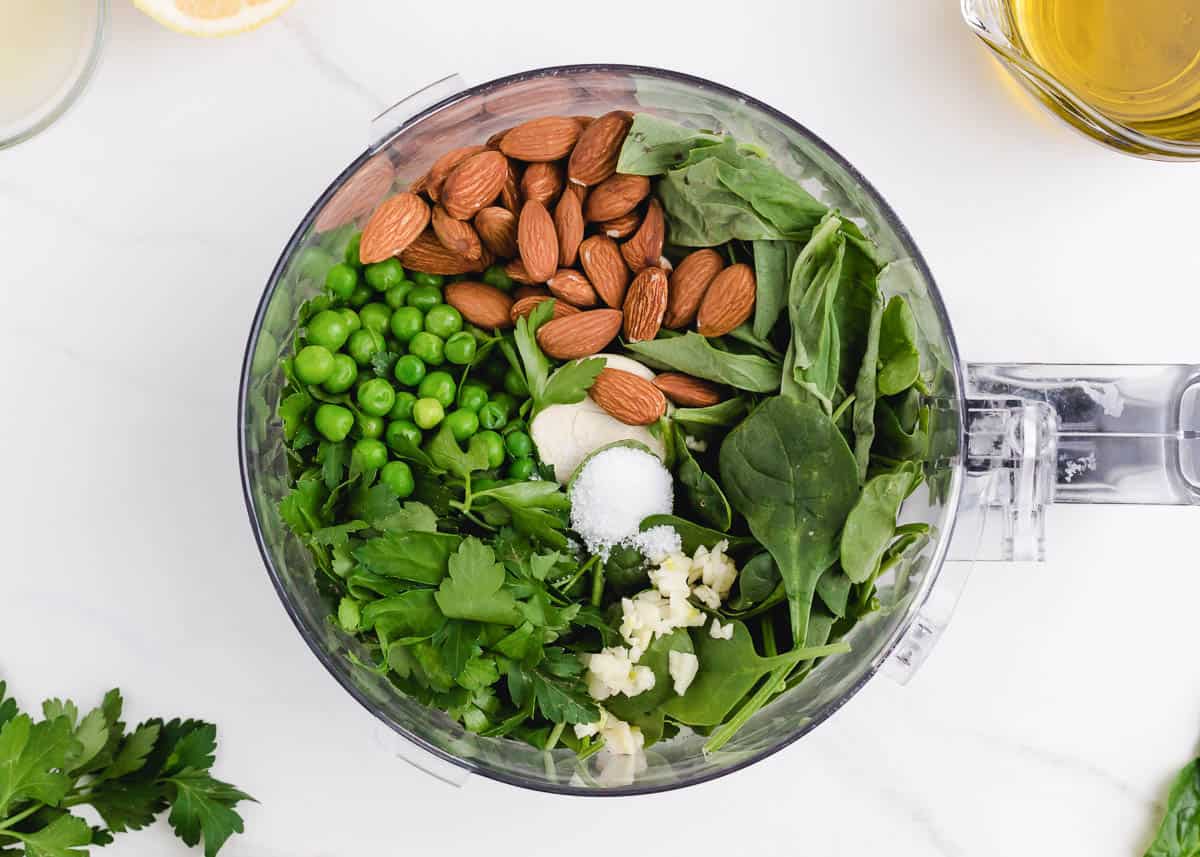 vegan pesto ingredients inside of food processor