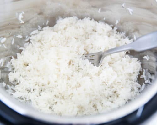 fluffing rice with fork