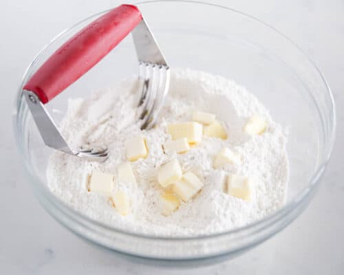 cutting butter into flour with pastry cutter