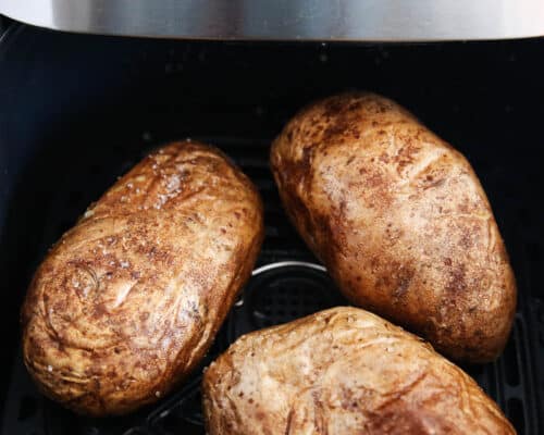 baked potatoes cooking in air fryer