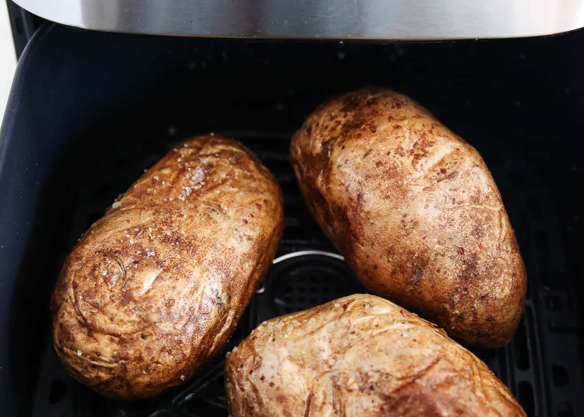 baked potatoes cooking in air fryer