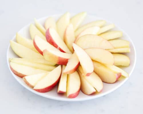 sliced apples on white plate