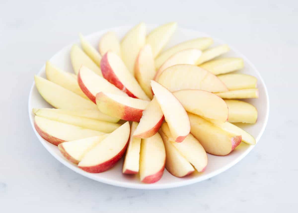 sliced apples on white plate