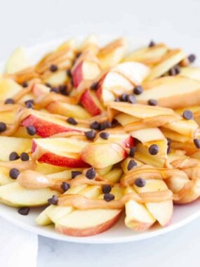 sliced apple nachos with peanut butter on top