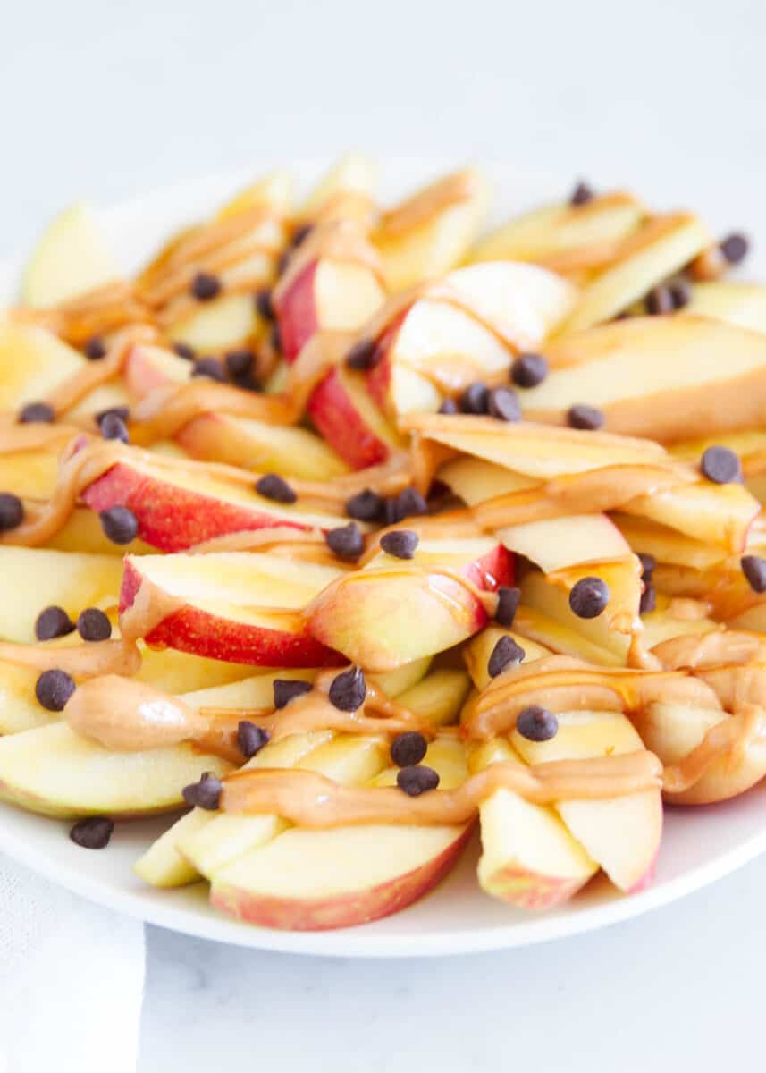 sliced apple nachos with peanut butter on top