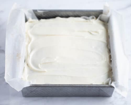 frosted carrot cake in square pan