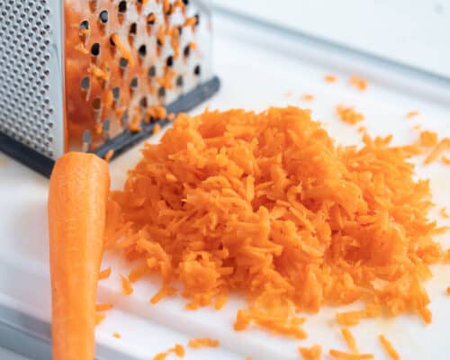 shredded carrots on cutting board