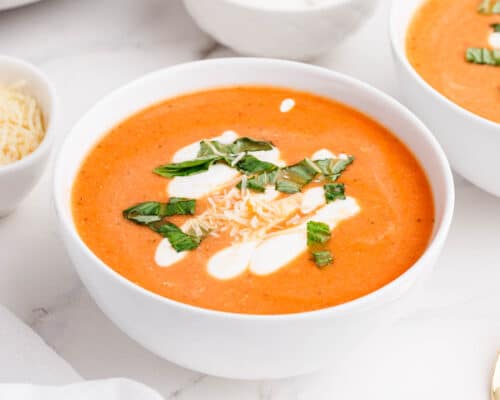 cauliflower tomato soup in white bowl