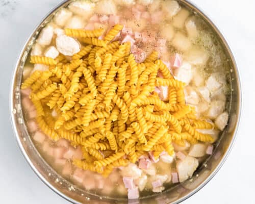 noodles, chicken and ham in pan