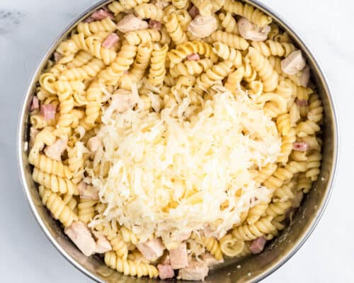 pasta and ham with cheese on top