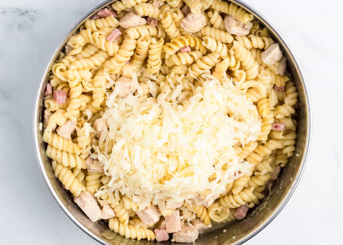 pasta and ham with cheese on top