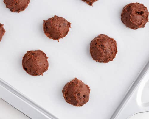 chocolate cookie dough balls on pan