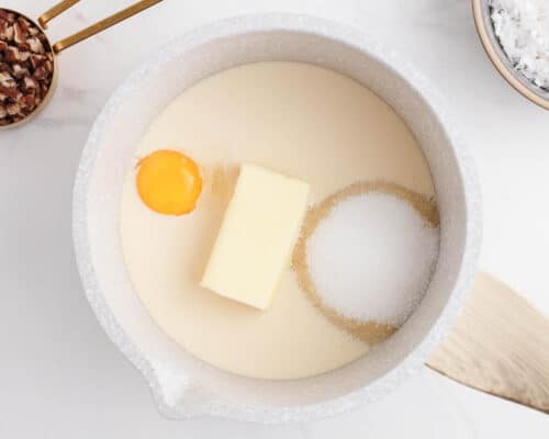 butter, sugar and egg in pot