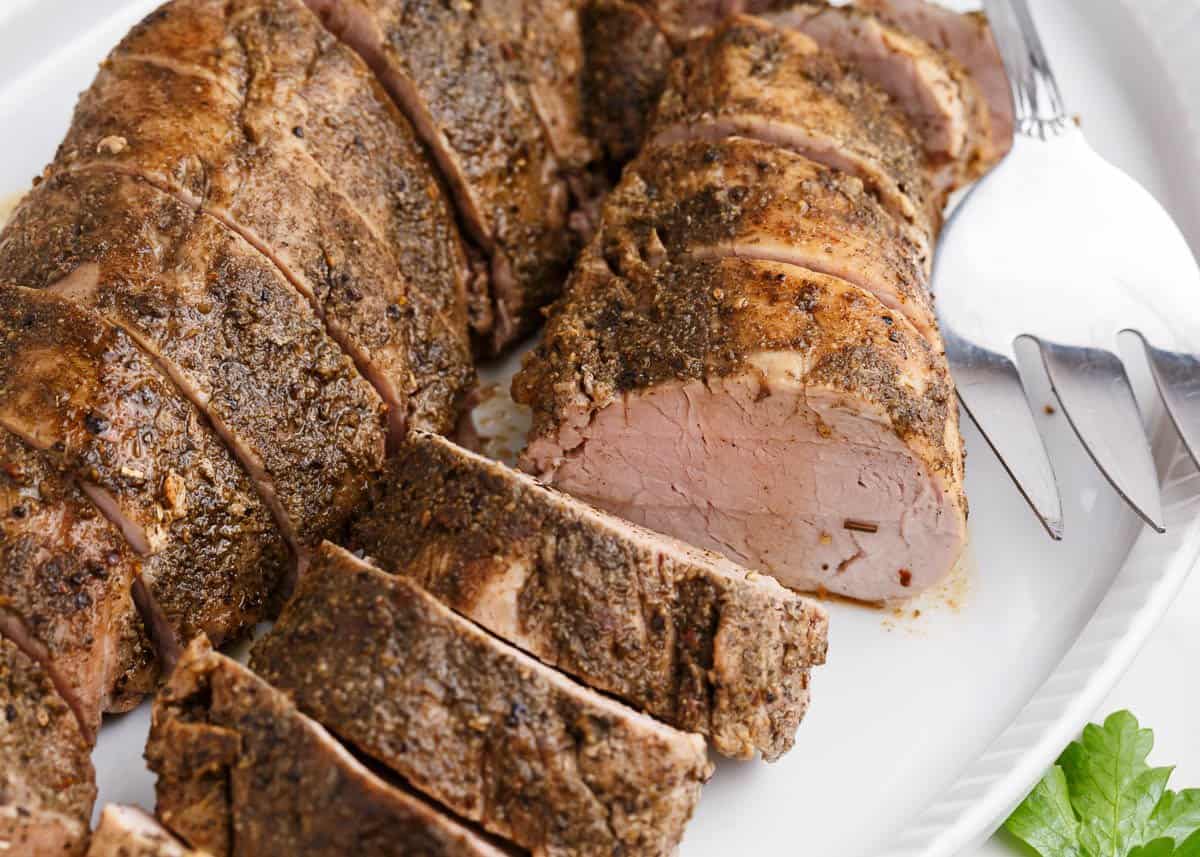 sliced pork tenderloin on plate