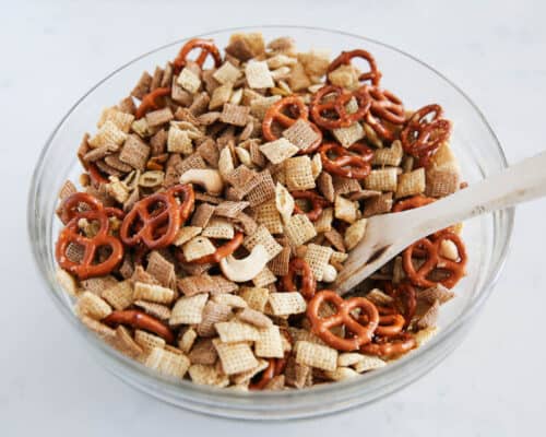 mixing chex mix in a bowl