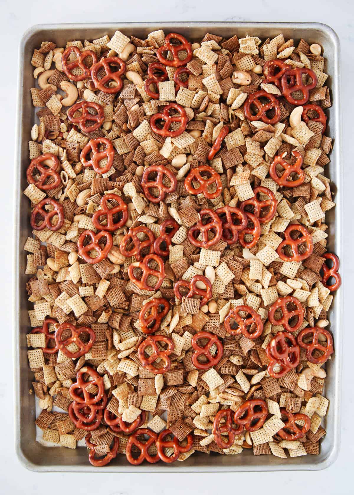 chex mix on a baking sheet