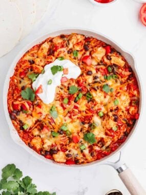 skillet full of mexican chicken and rice