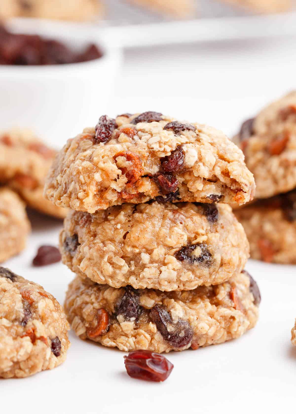 A stack of oatmeal raisin cookies on counter.