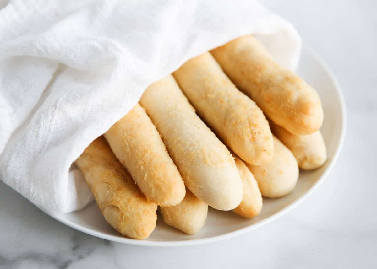 breadsticks on a white plate