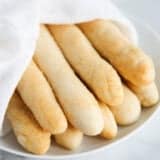 breadsticks on a white plate