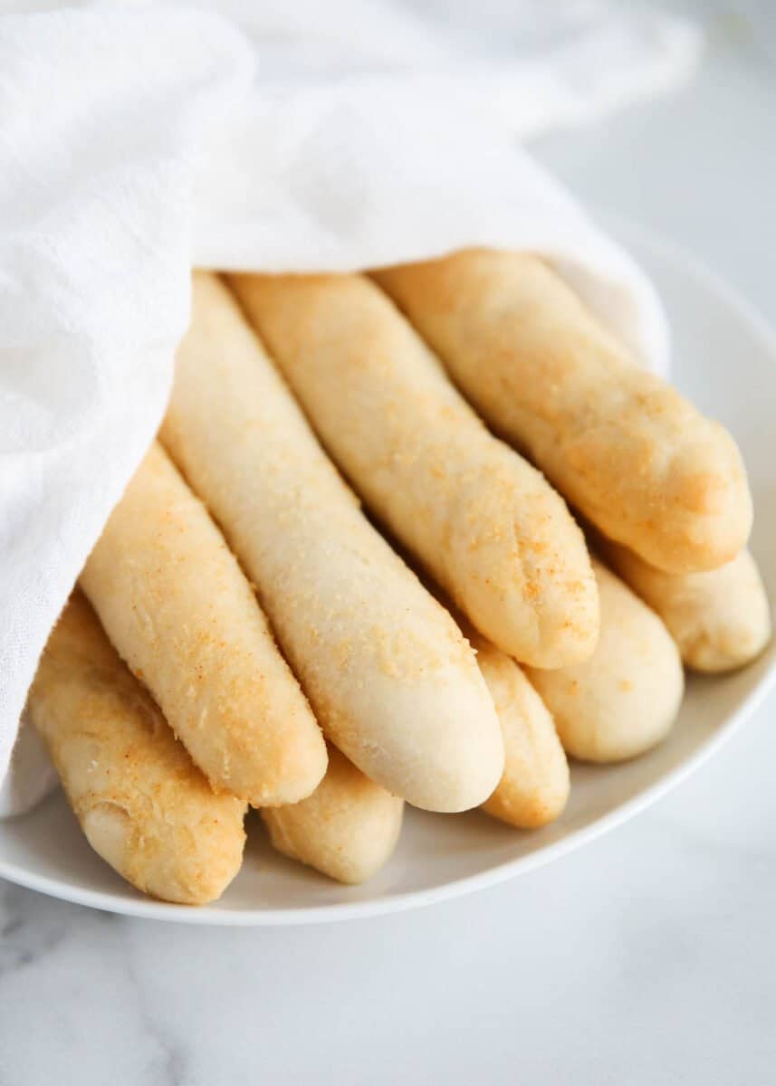 breadsticks on a white plate