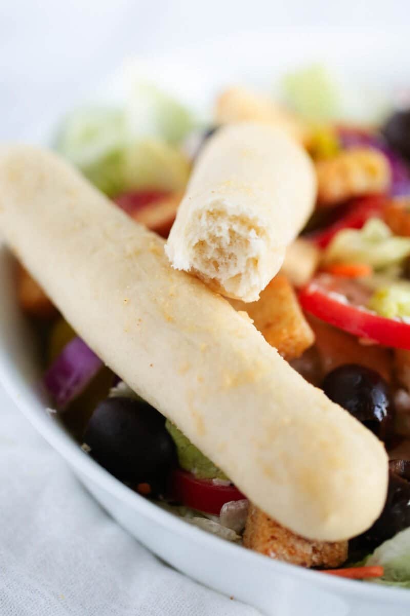 broken breadsticks on top of a plate