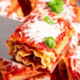 pepperoni lasagna roll up being scooped out of pan