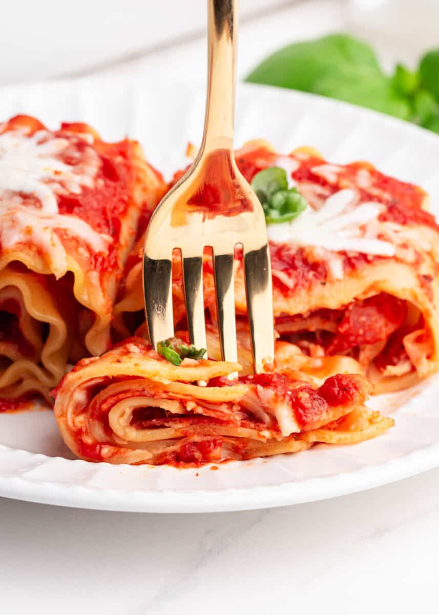 fork with lasagna on plate