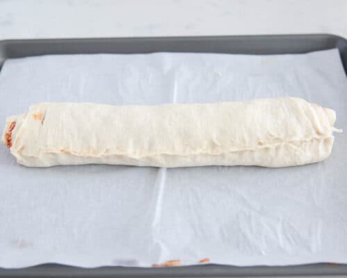 roll of dough on pan