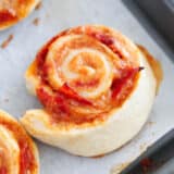 pizza pinwheels on baking sheet