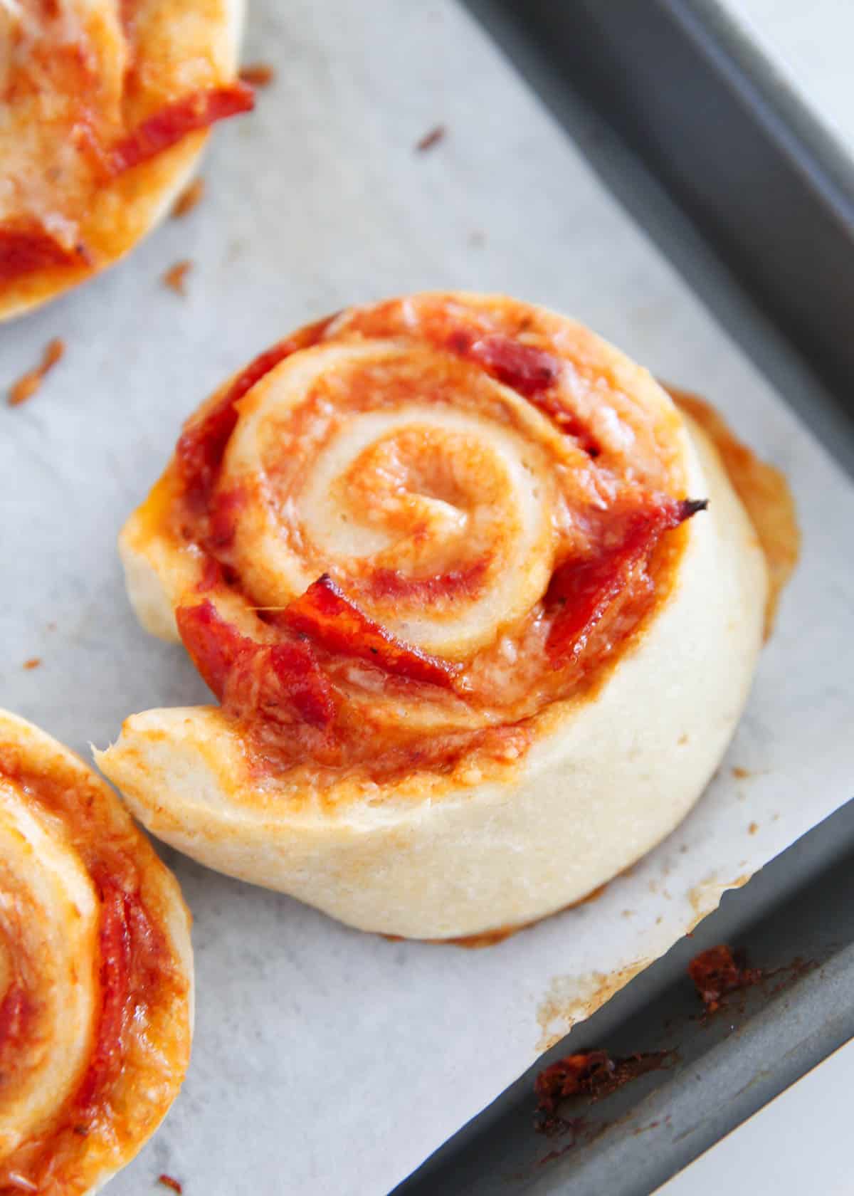 pizza pinwheels on baking sheet