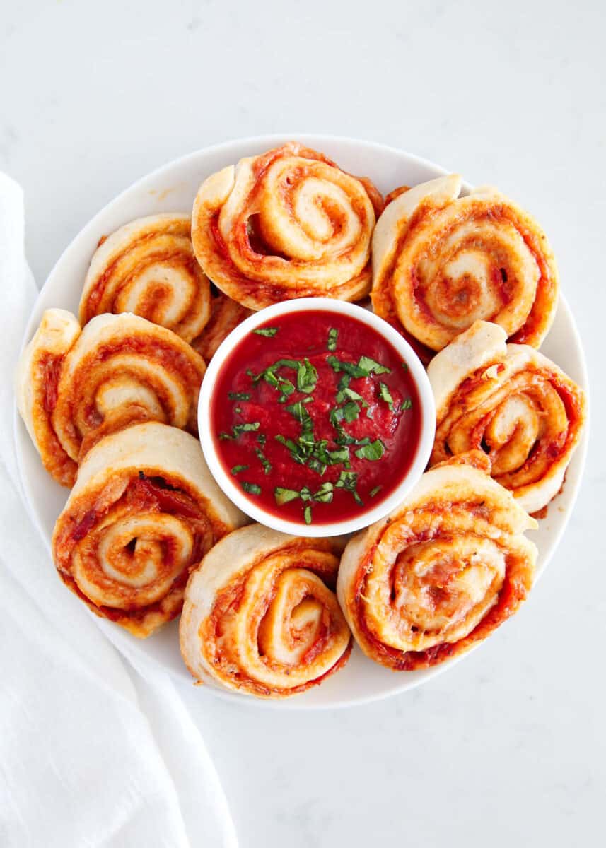 pizza pinwheels on white plate