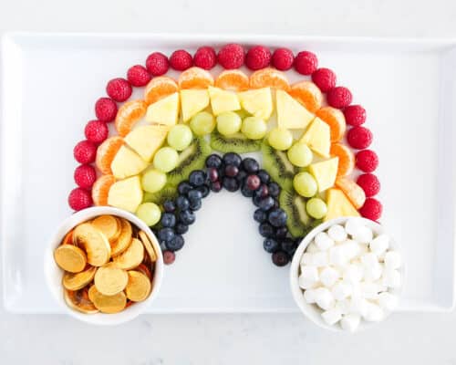 rainbow fruit platter on white plate