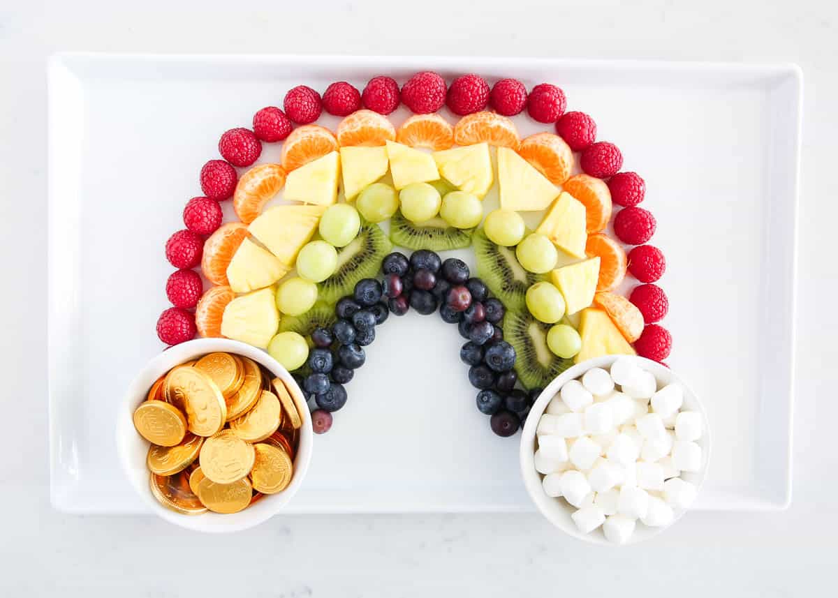 rainbow fruit platter on white plate
