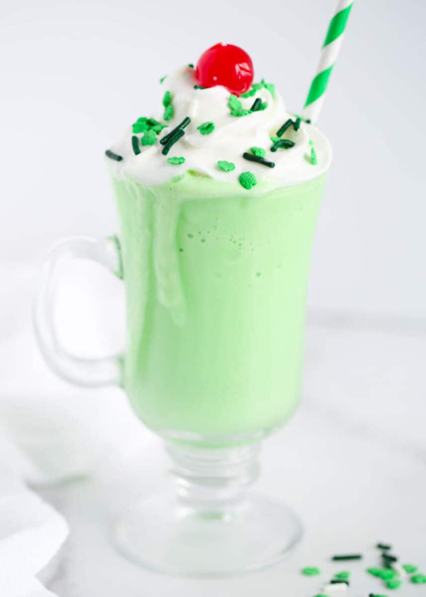 shamrock shake with whipped cream and cherry on top