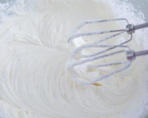 mixing cream cheese in bowl