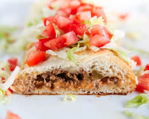 sliced taco braid with tomatoes and lettuce