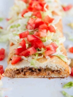 sliced taco braid with tomatoes and lettuce