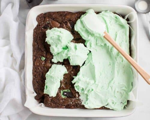 brownies with mint frosting in baking dish