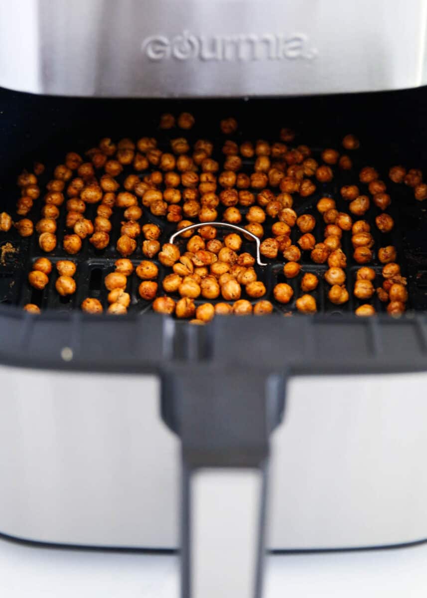 Chickpeas in air fryer basket.