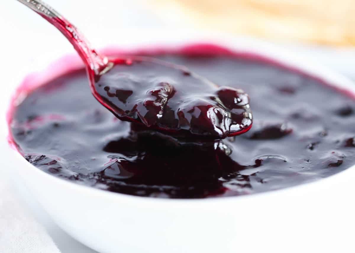 A spoonful of blueberry sauce. 