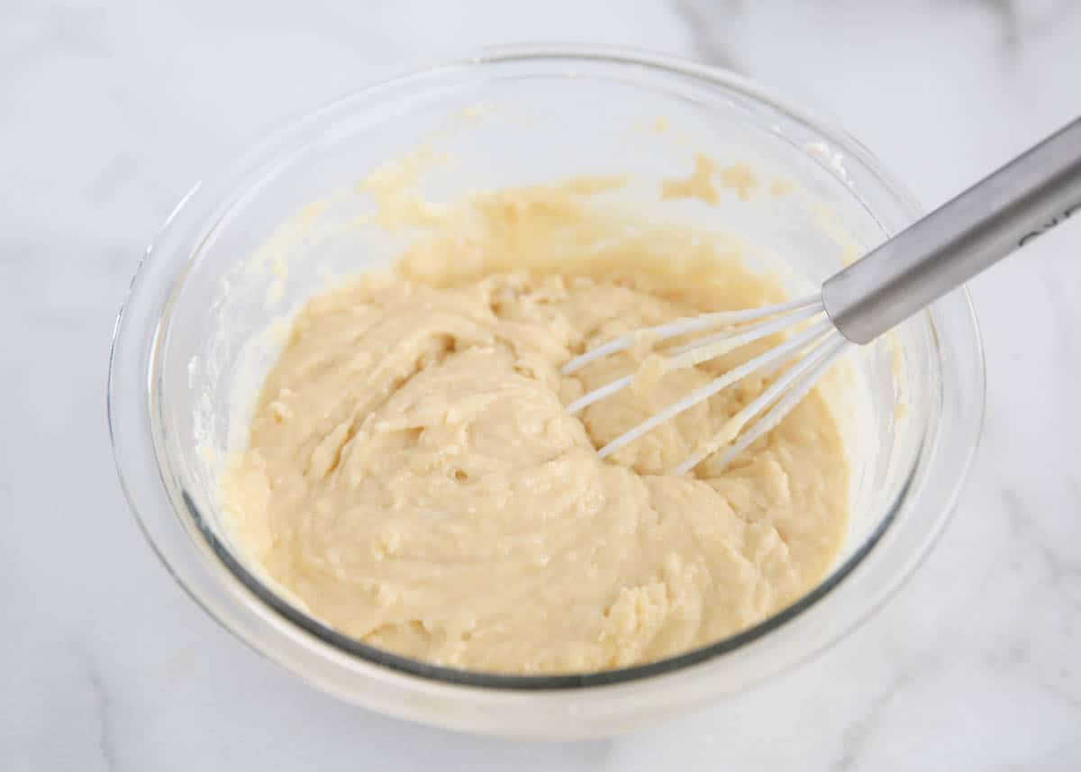 Making breakfast muffin batter in a bowl.