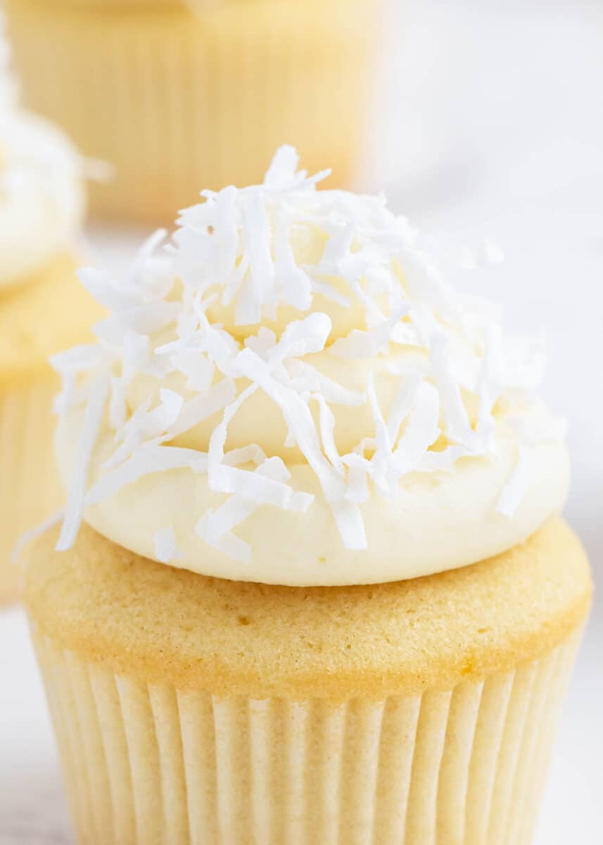 Coconut frosting on top of cupcake.